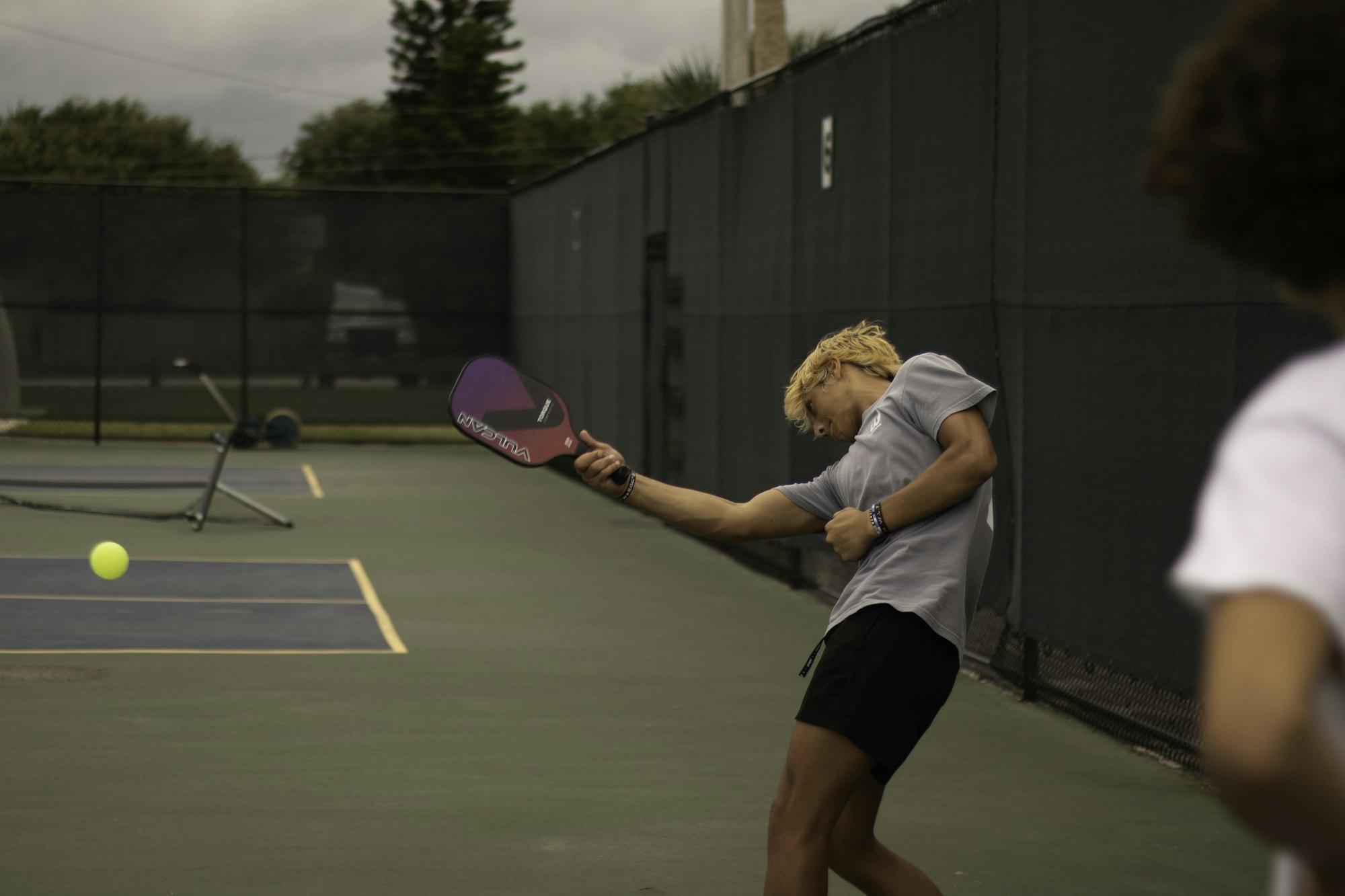 Player mid-swing on court