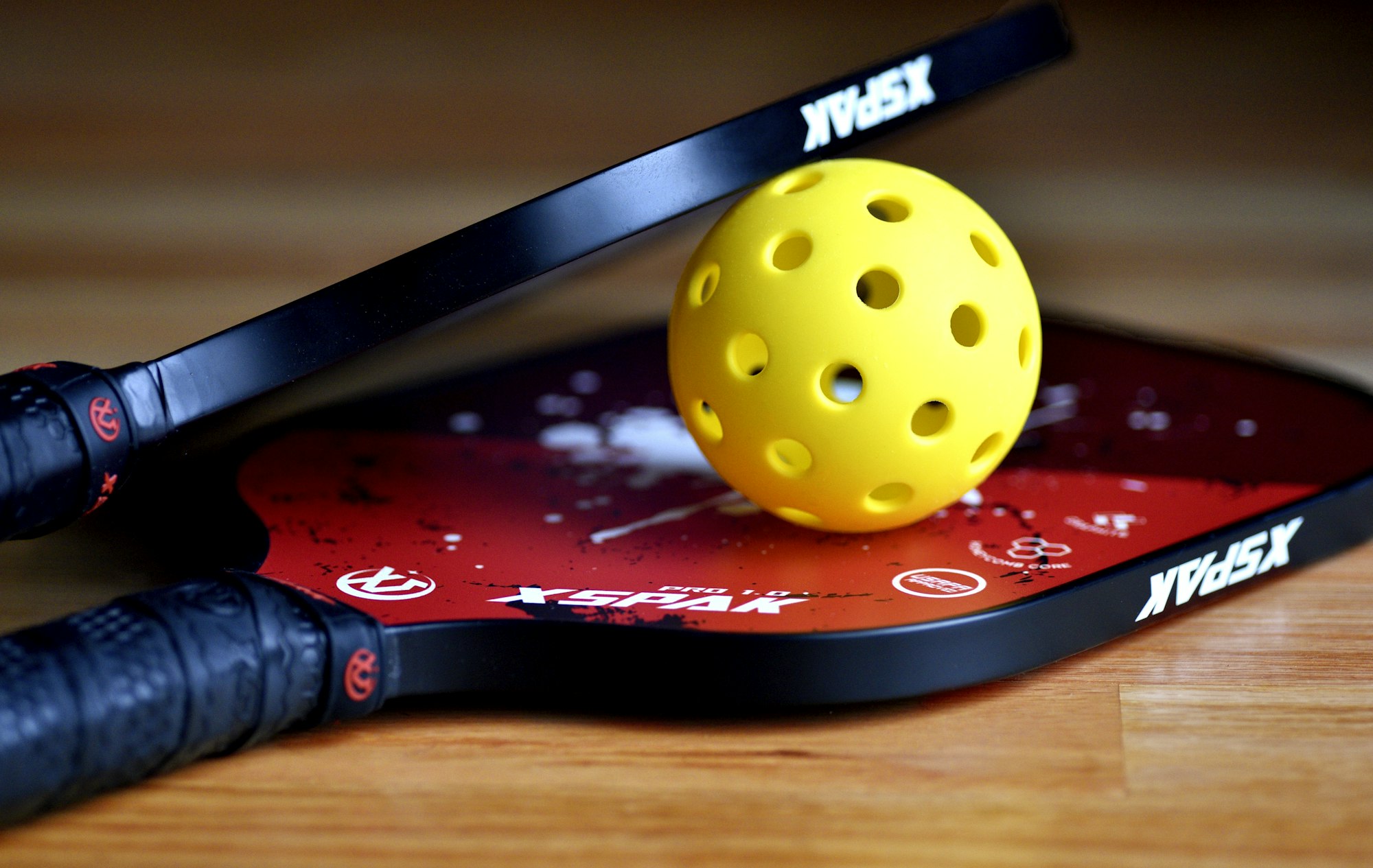 Ball resting on a paddle